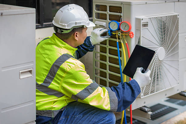 Professional Heat Pump Repair technician working in Milburn, KY